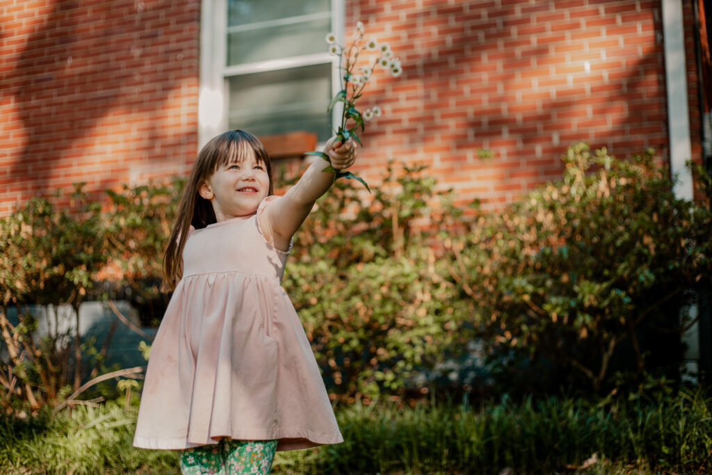 Little girl standing in front porch for family session in atlanta, georgia