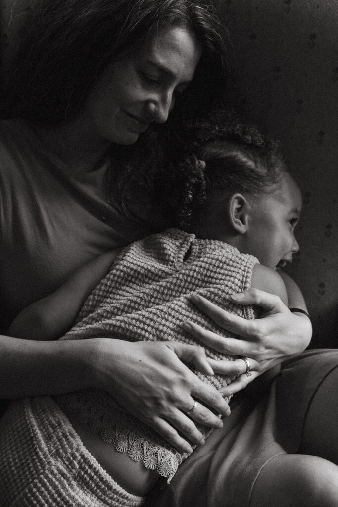 Black and white photo of mom with toddler during in-home family session in Atlanta, GA